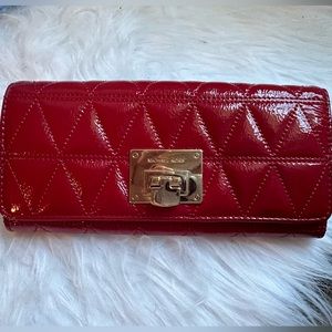 MK wallet. Patent leather red. Excellent condition. Like new.